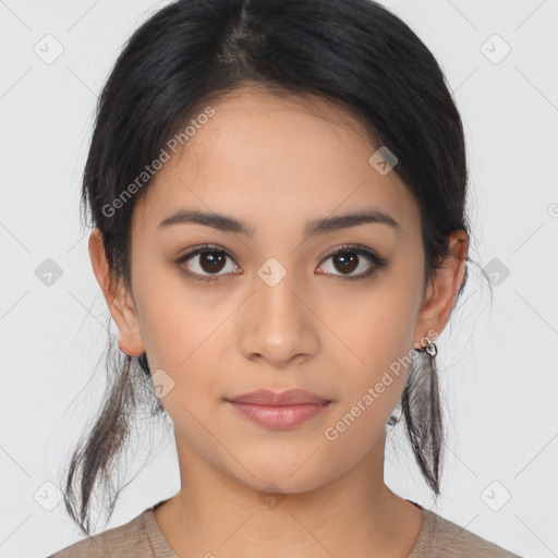 Joyful latino young-adult female with medium  brown hair and brown eyes