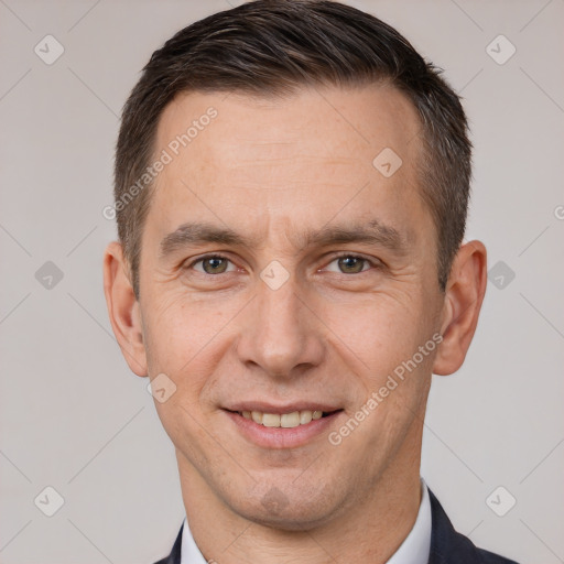 Joyful white adult male with short  brown hair and brown eyes