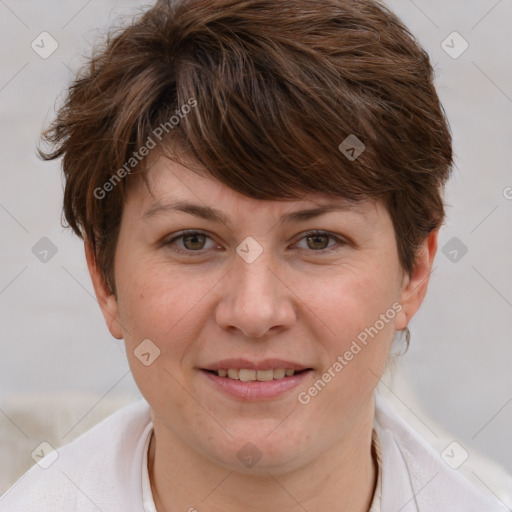 Joyful white adult female with short  brown hair and grey eyes