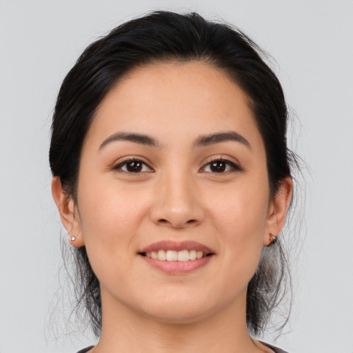 Joyful asian young-adult female with medium  brown hair and brown eyes