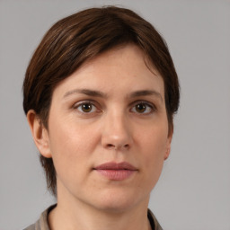 Neutral white young-adult female with medium  brown hair and brown eyes