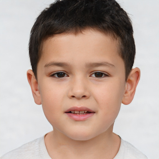 Joyful white child male with short  brown hair and brown eyes