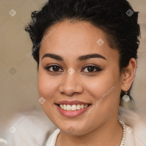 Joyful latino young-adult female with long  brown hair and brown eyes