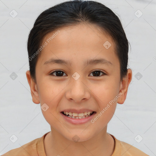 Joyful white child female with short  brown hair and brown eyes