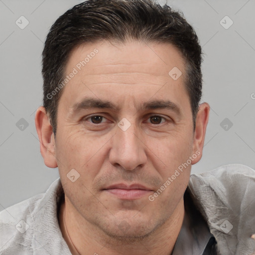 Joyful white adult male with short  brown hair and brown eyes