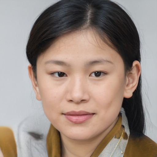 Joyful asian young-adult female with medium  brown hair and brown eyes