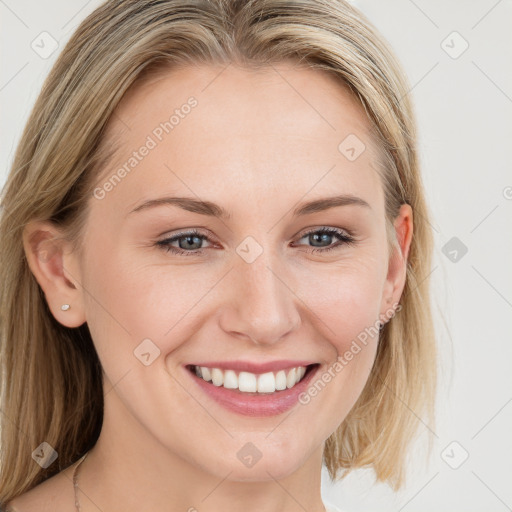 Joyful white young-adult female with long  brown hair and blue eyes