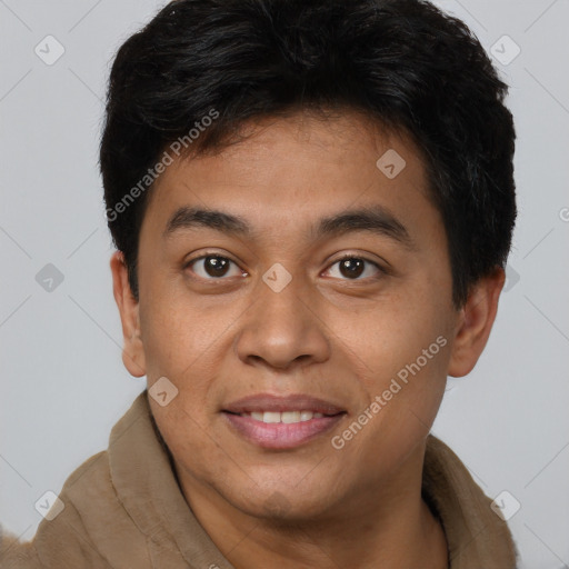 Joyful latino young-adult male with short  brown hair and brown eyes