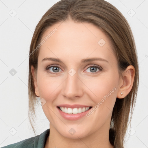 Joyful white young-adult female with long  brown hair and grey eyes