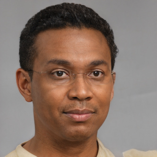 Neutral black adult male with short  black hair and brown eyes