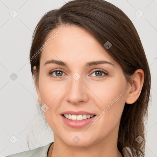 Joyful white young-adult female with medium  brown hair and grey eyes