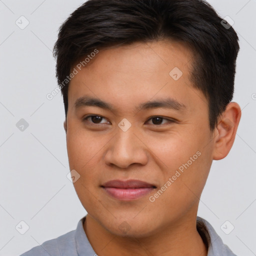 Joyful asian young-adult male with short  brown hair and brown eyes