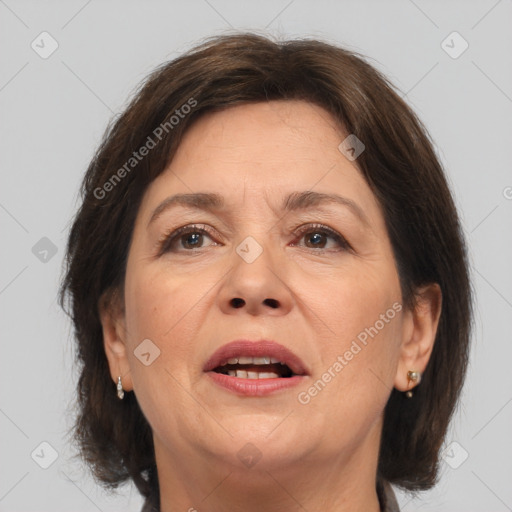 Joyful white adult female with medium  brown hair and brown eyes