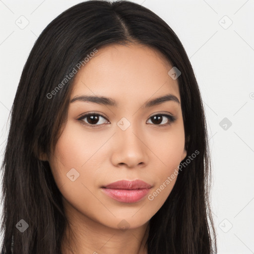 Joyful latino young-adult female with long  brown hair and brown eyes