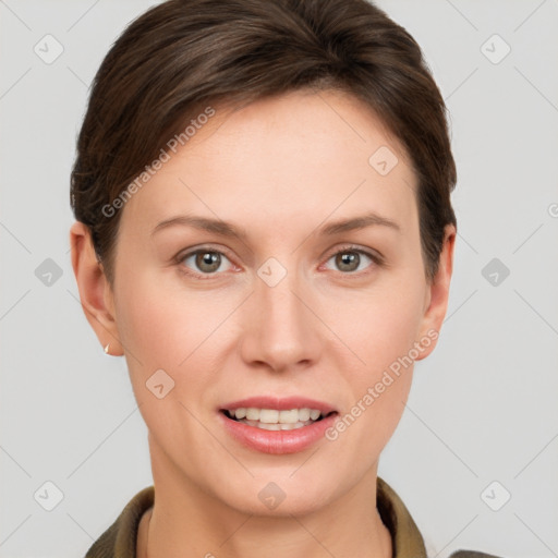 Joyful white young-adult female with short  brown hair and grey eyes