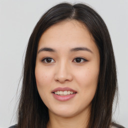 Joyful asian young-adult female with long  brown hair and brown eyes