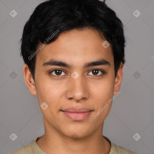 Joyful latino young-adult male with short  brown hair and brown eyes