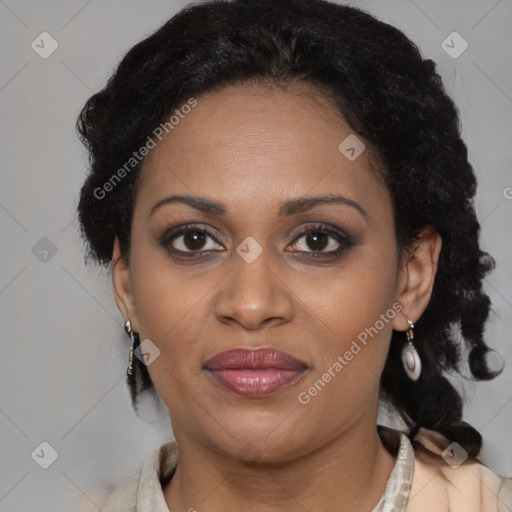 Joyful black adult female with medium  brown hair and brown eyes