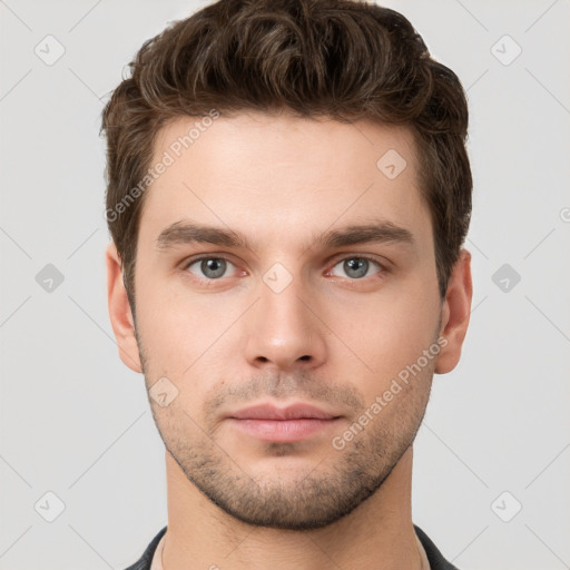 Neutral white young-adult male with short  brown hair and brown eyes