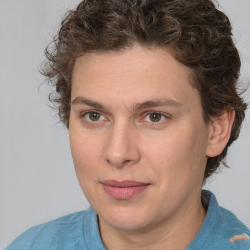 Joyful white young-adult male with medium  brown hair and brown eyes