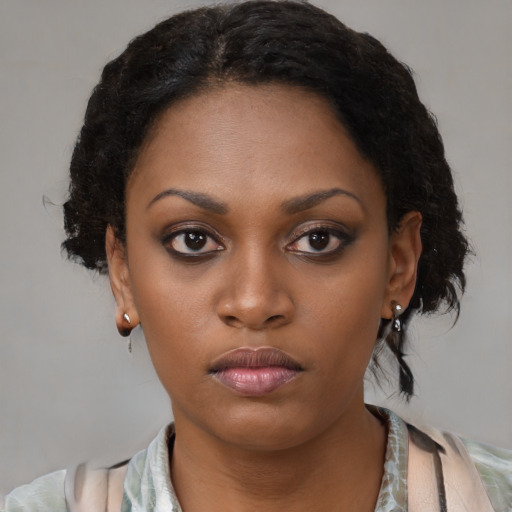Neutral black young-adult female with medium  black hair and brown eyes