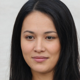 Joyful asian young-adult female with long  brown hair and brown eyes