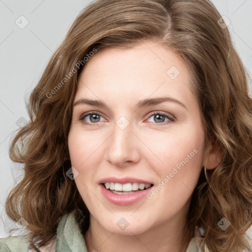 Joyful white young-adult female with medium  brown hair and green eyes