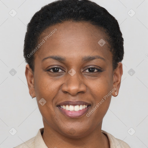 Joyful black young-adult female with short  brown hair and brown eyes