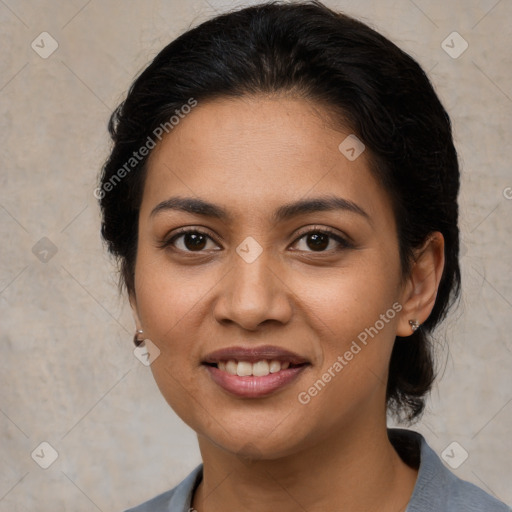 Joyful latino young-adult female with medium  brown hair and brown eyes