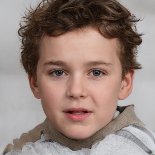 Joyful white child male with short  brown hair and brown eyes