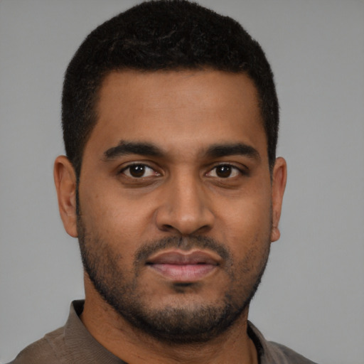 Neutral black young-adult male with short  black hair and brown eyes