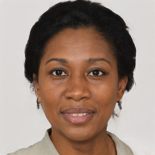 Joyful latino adult female with short  black hair and brown eyes
