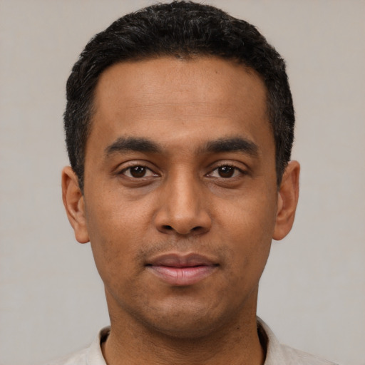 Neutral latino young-adult male with short  black hair and brown eyes