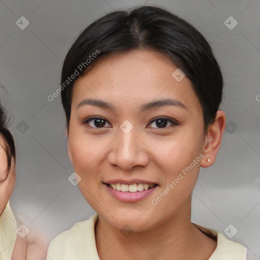 Joyful asian young-adult female with medium  brown hair and brown eyes