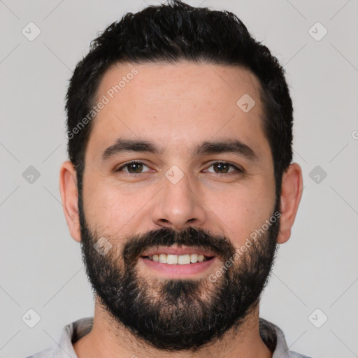 Joyful white young-adult male with short  black hair and brown eyes