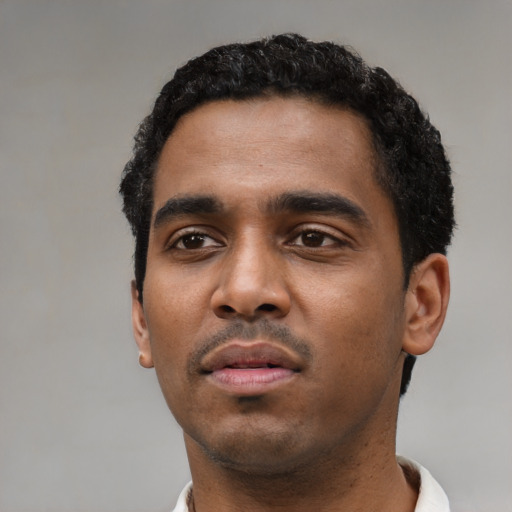 Neutral black young-adult male with short  black hair and brown eyes