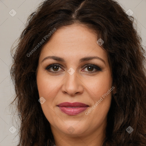 Joyful white adult female with long  brown hair and brown eyes