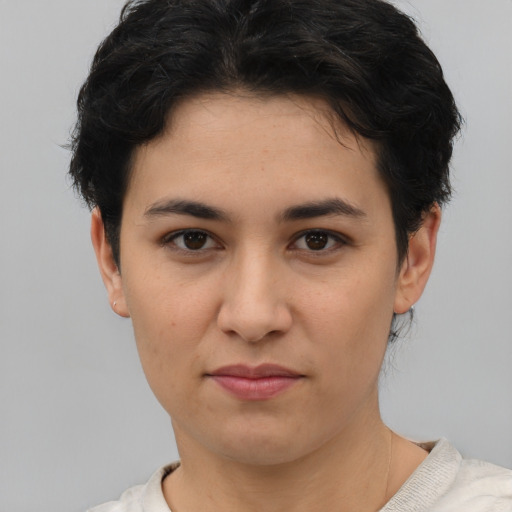 Joyful asian young-adult female with short  brown hair and brown eyes