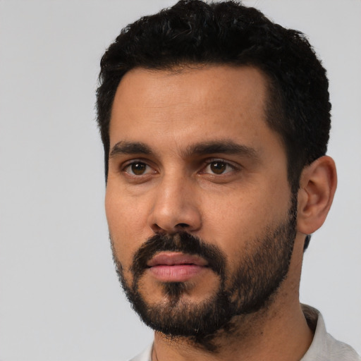 Neutral latino young-adult male with short  black hair and brown eyes