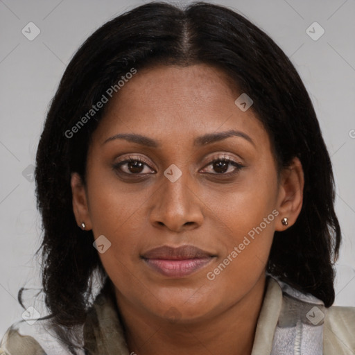 Joyful black young-adult female with medium  brown hair and brown eyes