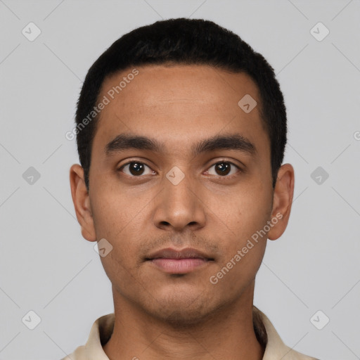 Neutral latino young-adult male with short  black hair and brown eyes