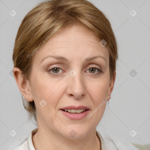 Joyful white adult female with medium  brown hair and grey eyes