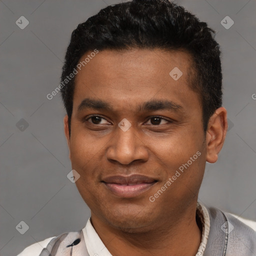 Joyful latino young-adult male with short  brown hair and brown eyes