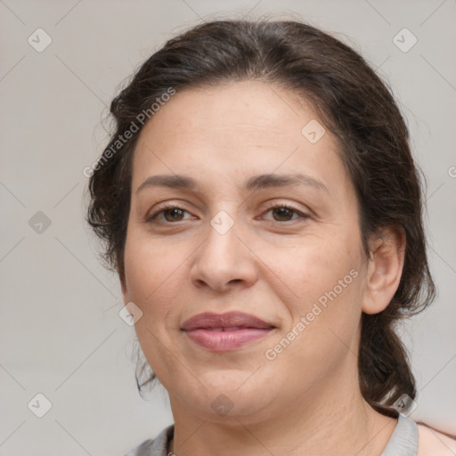 Joyful white adult female with medium  brown hair and brown eyes