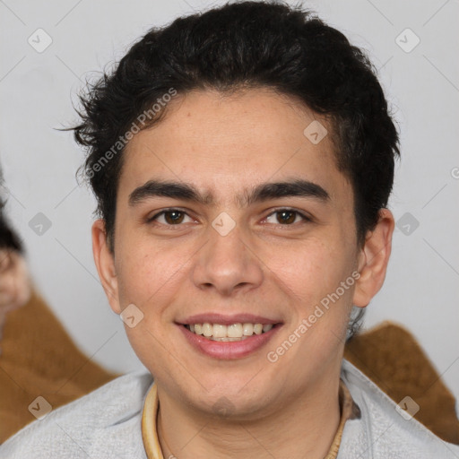 Joyful latino young-adult male with short  brown hair and brown eyes