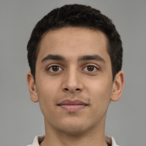 Neutral latino young-adult male with short  brown hair and brown eyes