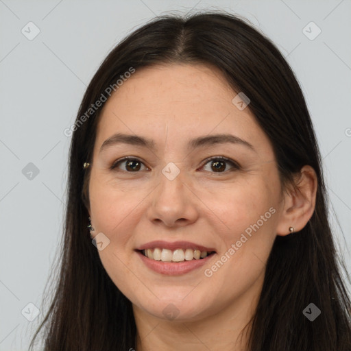 Joyful white young-adult female with long  brown hair and brown eyes