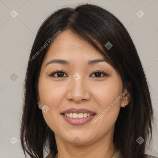 Joyful asian young-adult female with long  brown hair and brown eyes