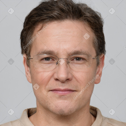 Joyful white adult male with short  brown hair and grey eyes