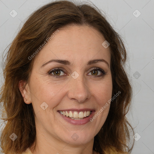 Joyful white adult female with long  brown hair and brown eyes